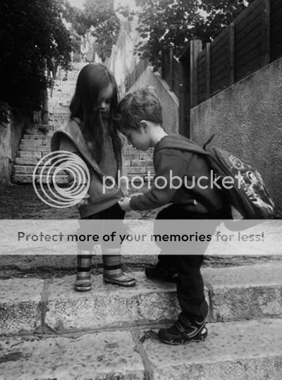 vintage photo boy helping girl with zipper