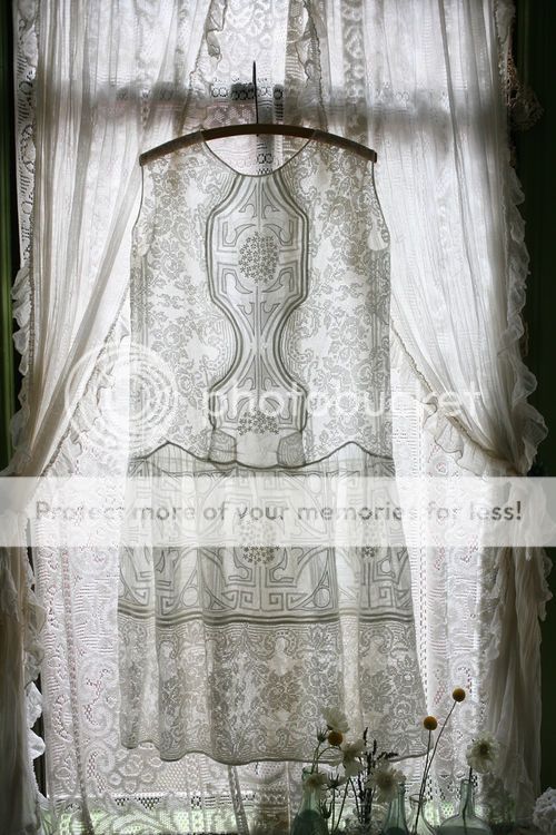 lace dress on hanger in window