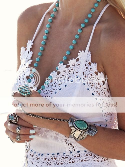 white dress and turquoise jewelry